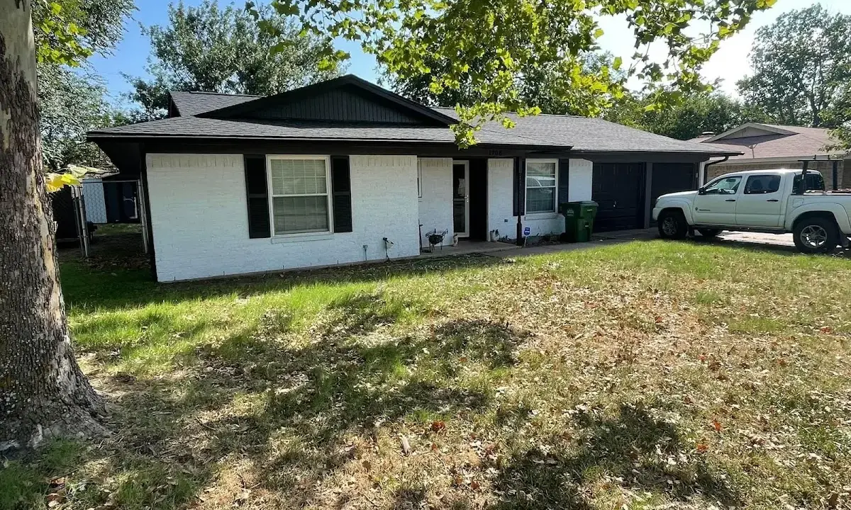 Professional roofing crew working on a residential roof in McCook